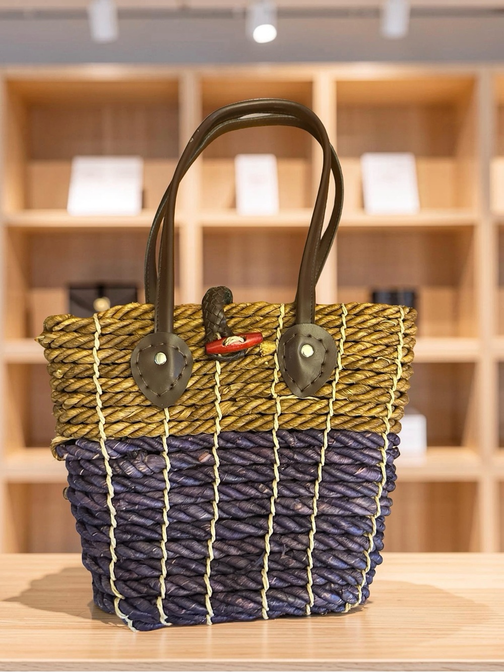 Two-Tone Woven Straw Tote in Brown and Navy with Dark Handles